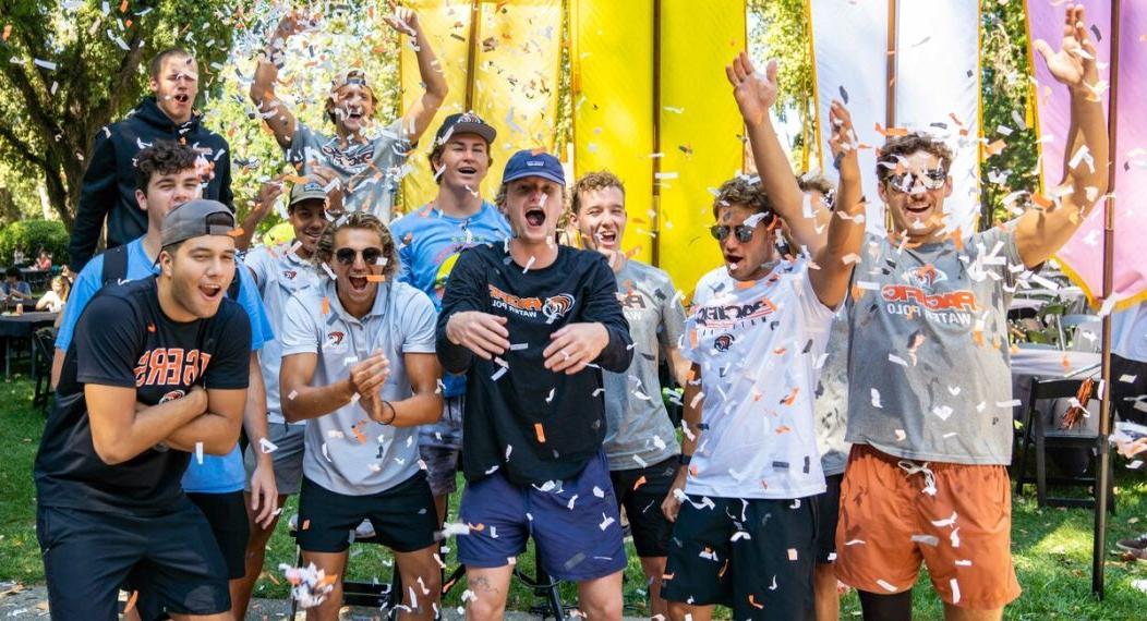 group of male university of the pacific students celebrating